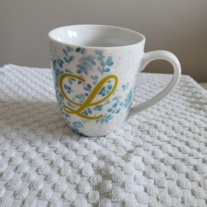 Pier 1 Import coffee/ tea mug with imprinted floral design.